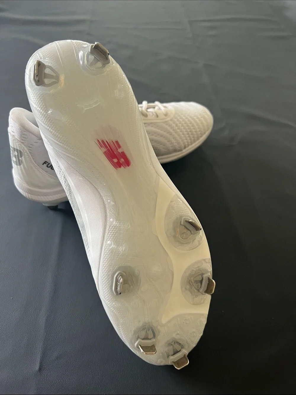 New Balance White Baseball Cleats with Black Logo